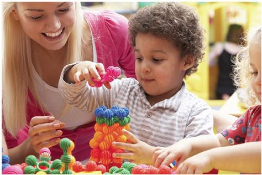 Lady and child playing with blocks