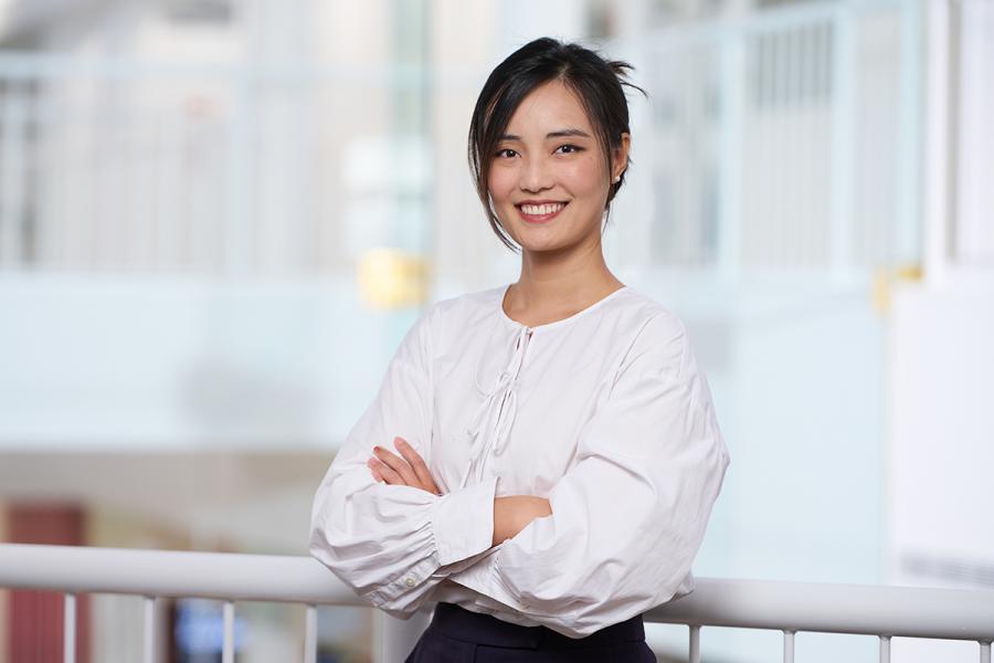 Image of young woman wearing a white top. 