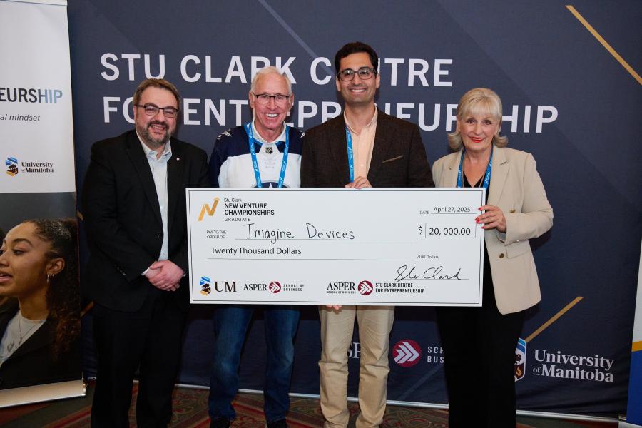 Imagine devices standing with cheque at Stu Clark New Venture Championships