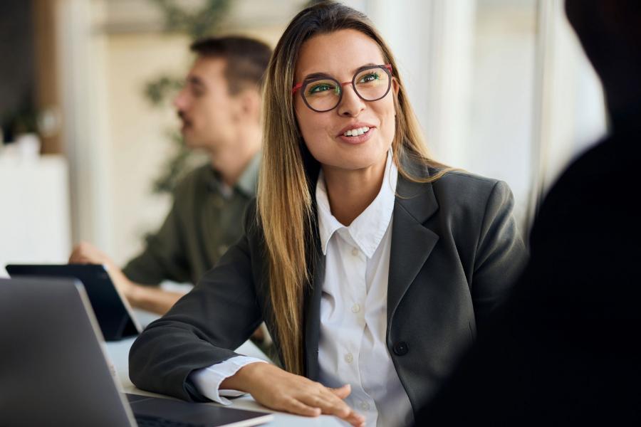 Business leader discussing cybersecurity with colleague.