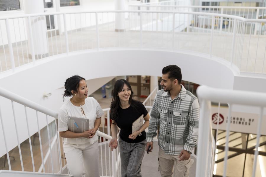 Students walking in the Asper School of Business