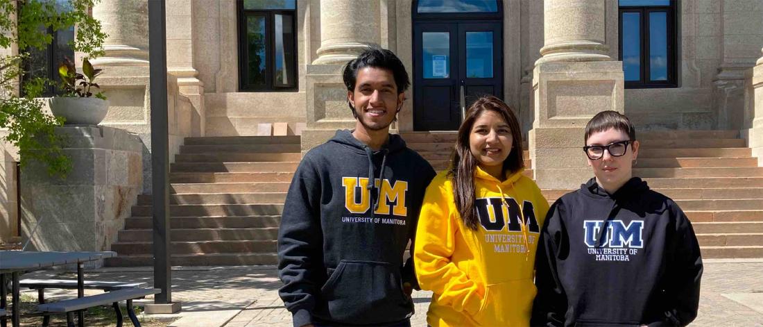 Group of students sporting UM logo sweatshirts.