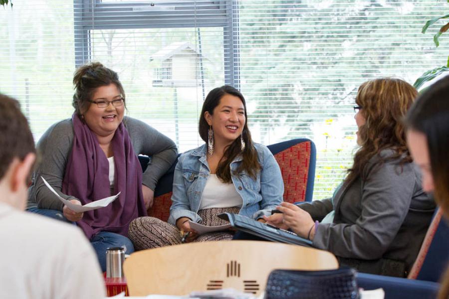 Students discussing in an indoors envrioment 