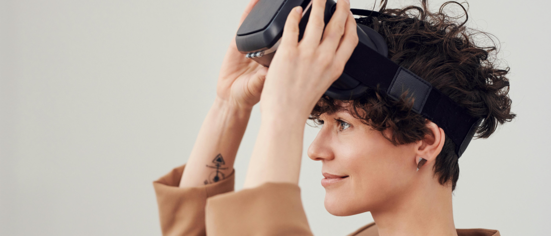 Person putting a VR headset on