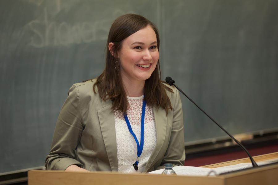 A graduate student chairs a concurrent presentation at the spring research symposium.