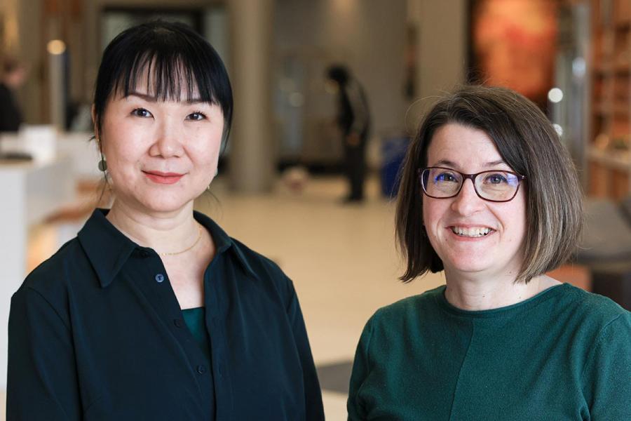 Centre researcher affiliates smiling in a lobby