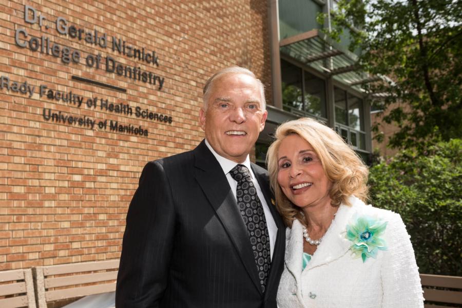 Dr. Gerald Niznick stands side by side with his wife Reesa Niznick outside the Dentistry building.