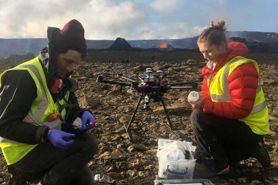 Brock Edwards mounting a mercury sampler on a drone for aerial measurement at the site of the eruption.