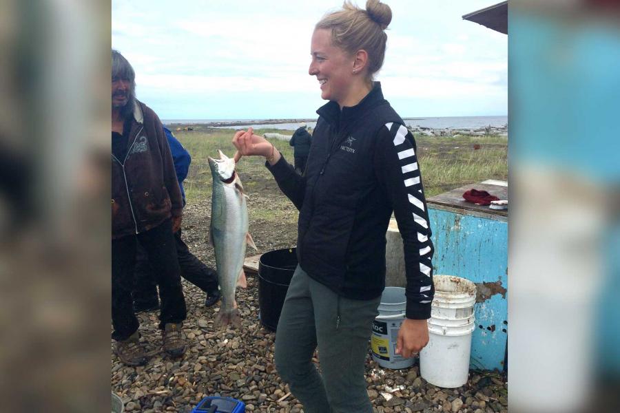 Elizabeth Worden holding a fish.