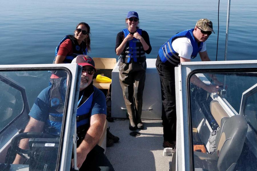 Emma Ausen and fellow researchers on a boat.