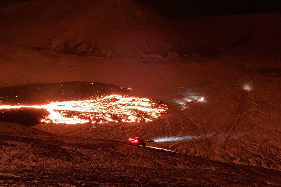 Incandescent lava fanning out into the valley of Meradalur.