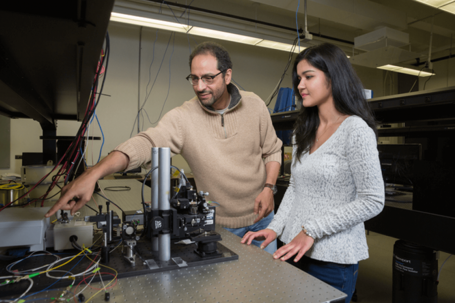 Sherif Sherif works in his lab with a student.