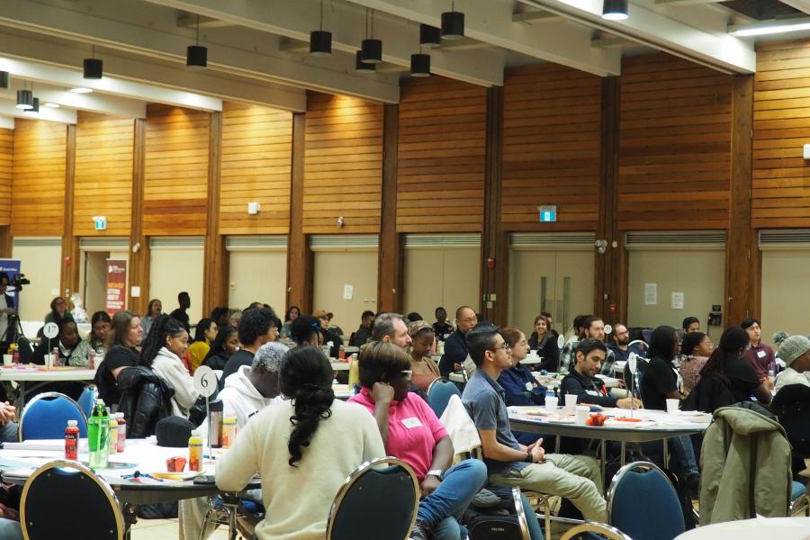 All participants of Better Together 2023 listening to a presenter