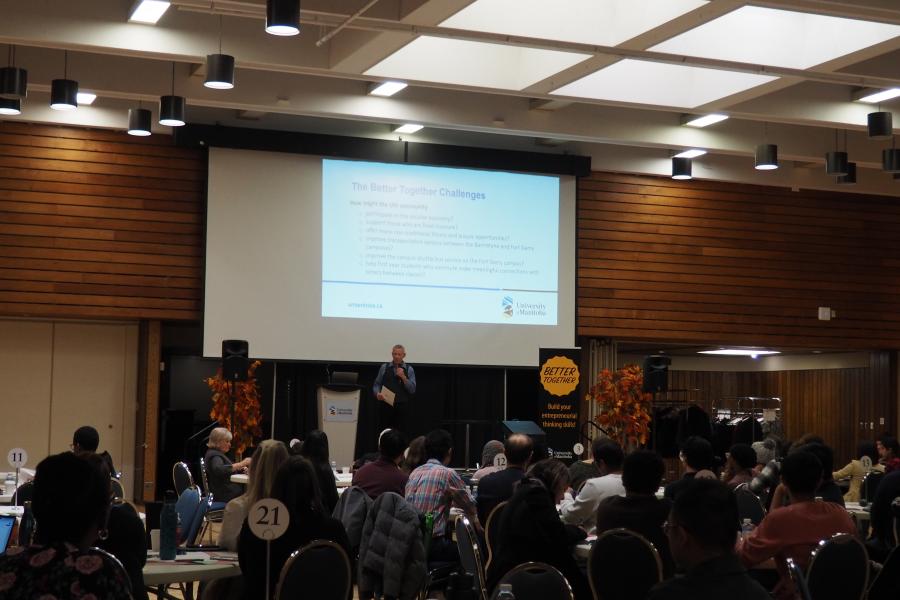 Presenter on stage at Better Together 2023