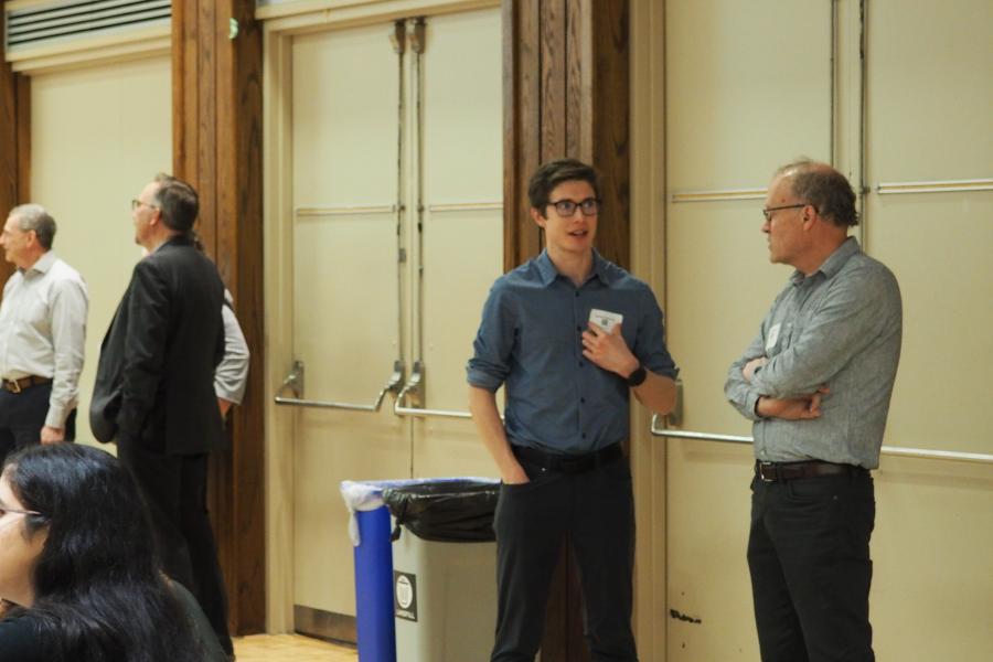 Two people standing having a discussion at Better Together 2023