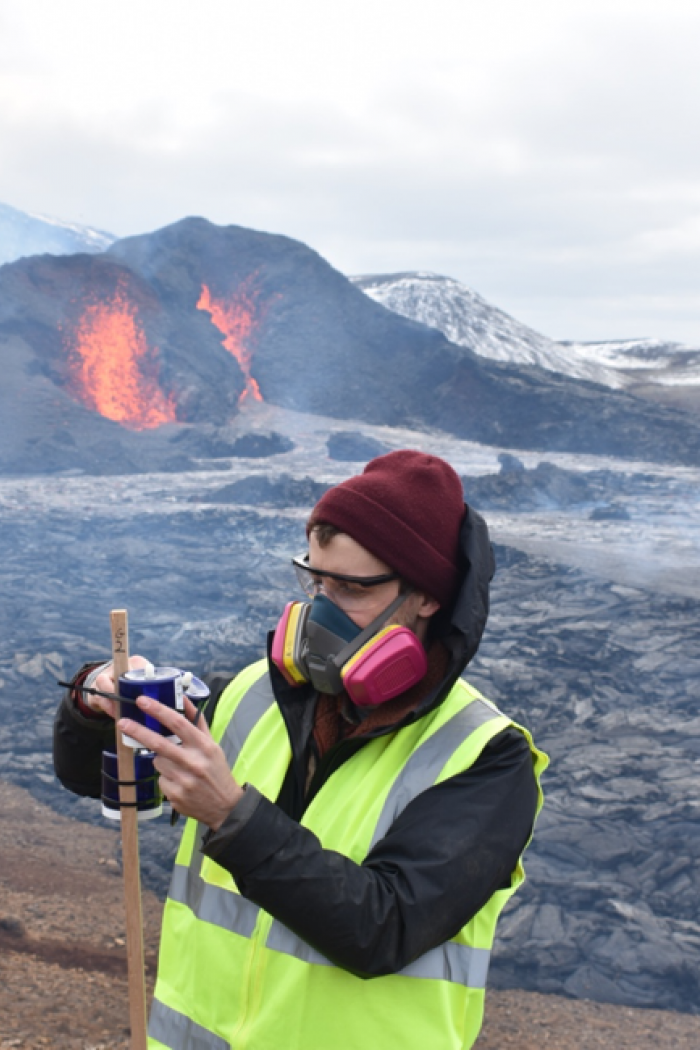 Brock Edwards taking samples at a volcano