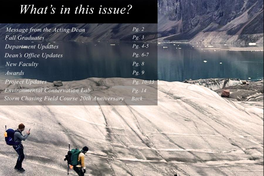 An image of three researchers in the field at a site in the Arctic.