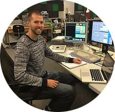 ryan sharpe sitting at his desk