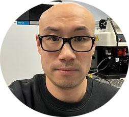 a headshot of wei wang
