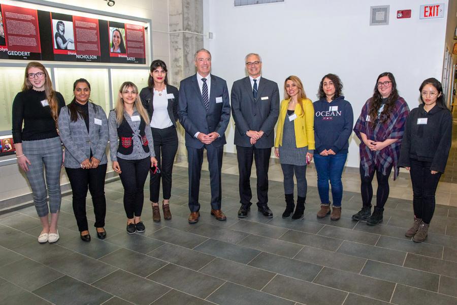 Eight awards winning female engineering students stand for a photo.