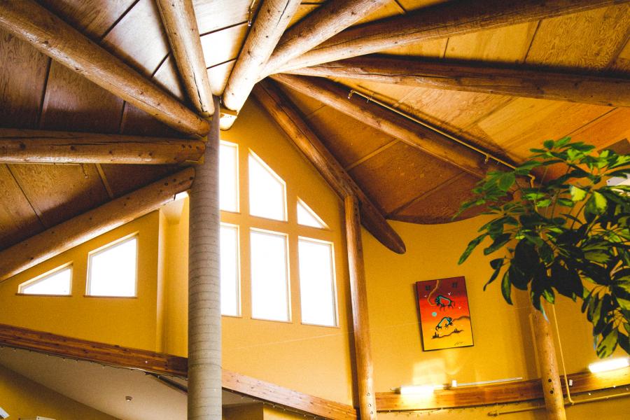 An interior image of the beautiful wood construction and sunlight though the windows of the rooftop of the William Norrie building.