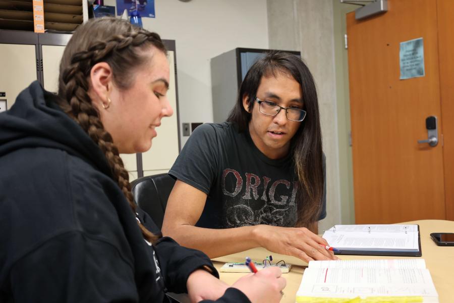 Two students studying together at a desk