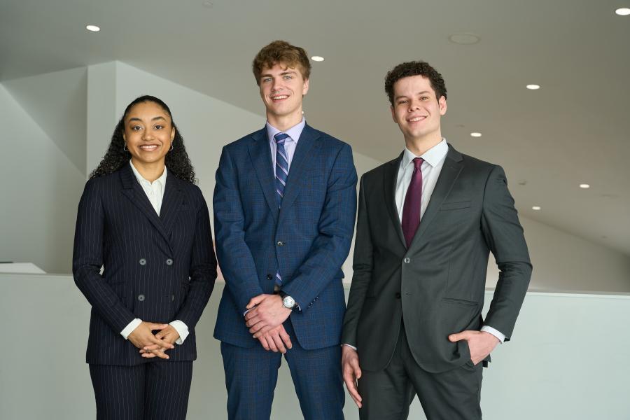 BComm students pose confidently after winning a case competition.