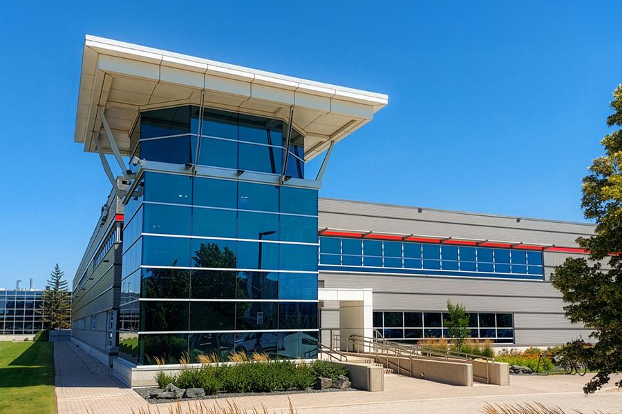 Large building with many windows located at 155 Innovation Drive.