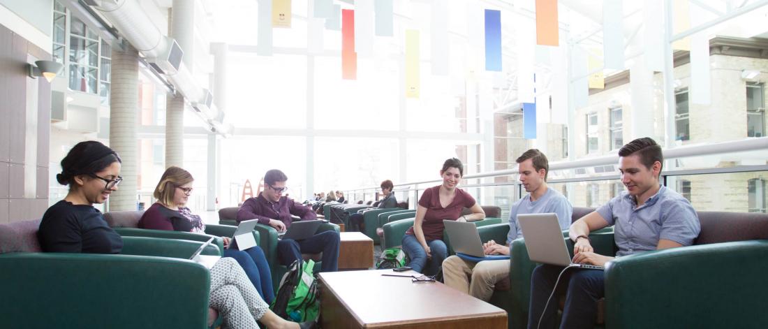 Students seated in a lounge area at the University of Manitoba Bannatyne campus.