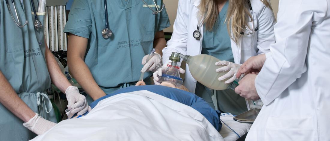 A simulation patient is being intubated.