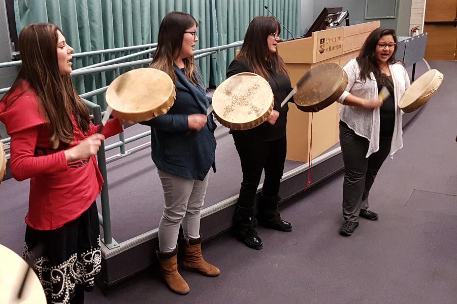 Group of Indigenous drummers welcomes guests to an event