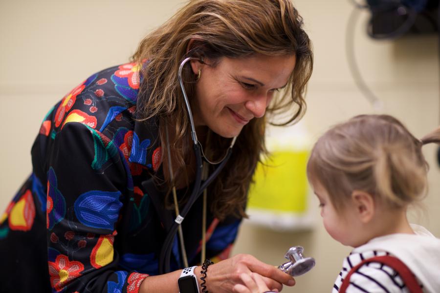 Physician with child patient