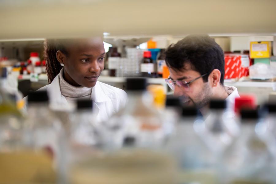 Two people working in a lab.