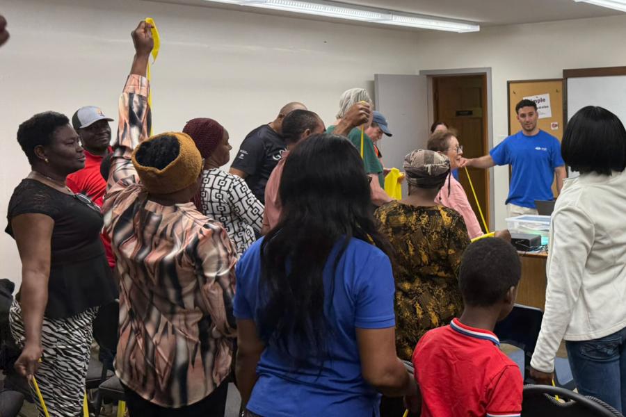 Community members participate in a health and movement session led by the WISH Clinic