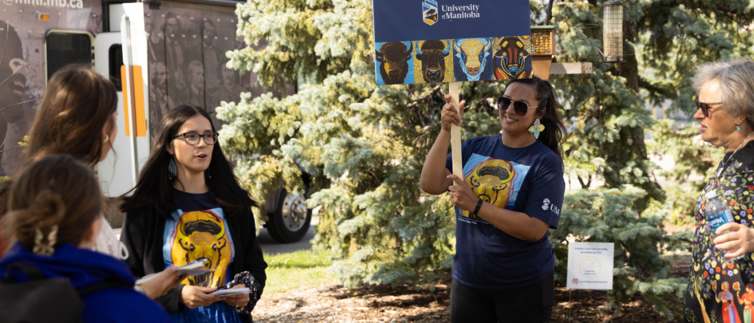 Orientation leaders guiding new students during an Indigenous campus tour.