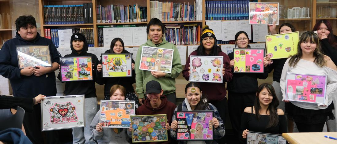 Indigenous students showcase their vision and sit in a group