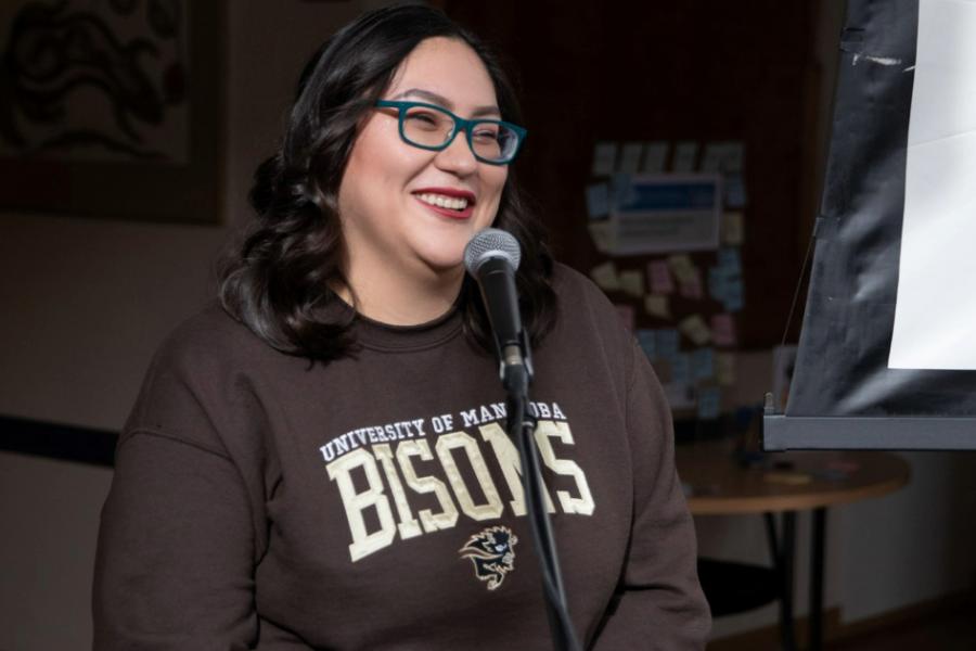 Image of woman wearing bisons sweater