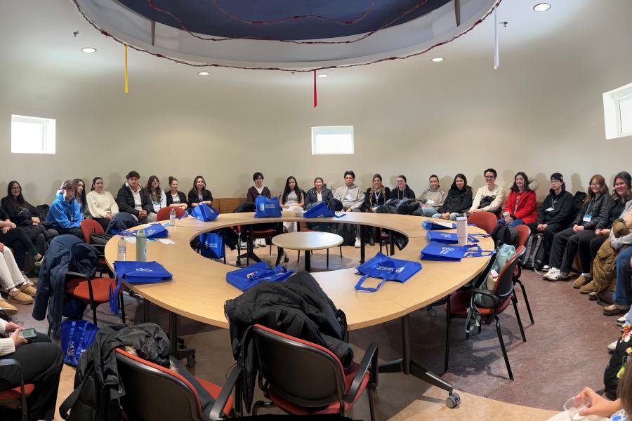 Group of Indigenous students collaborate in the Circle Room at the University of Manitoba.