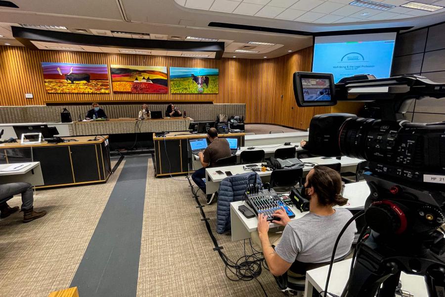 Crew working equipment in University of Manitoba auditorium.