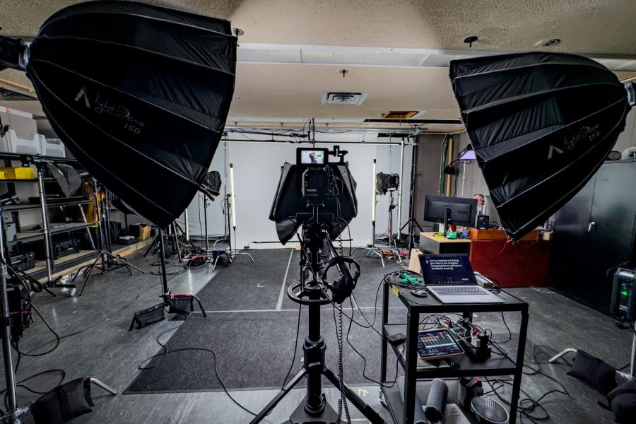 Video production studio with video cameras and screen
