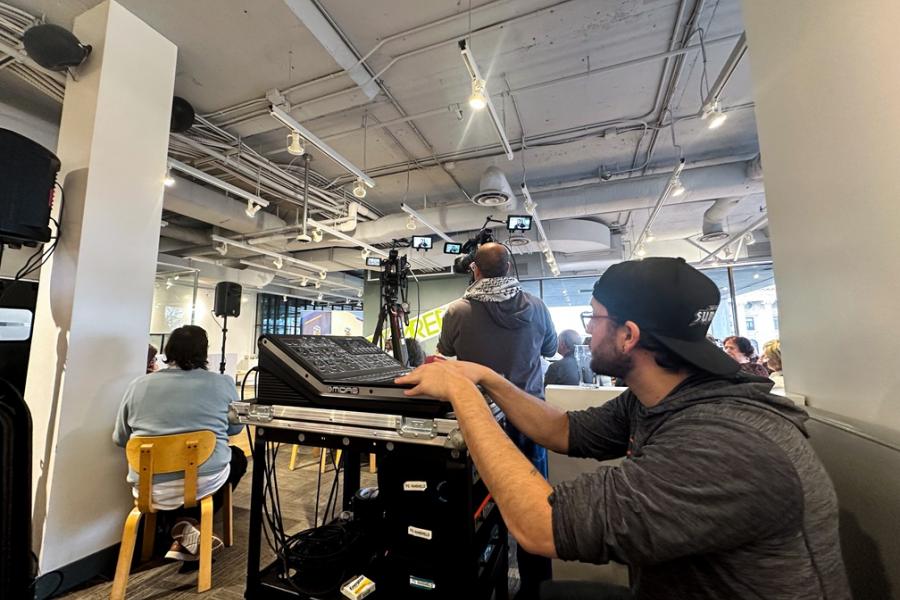 Man sitting at video production panel during a recording