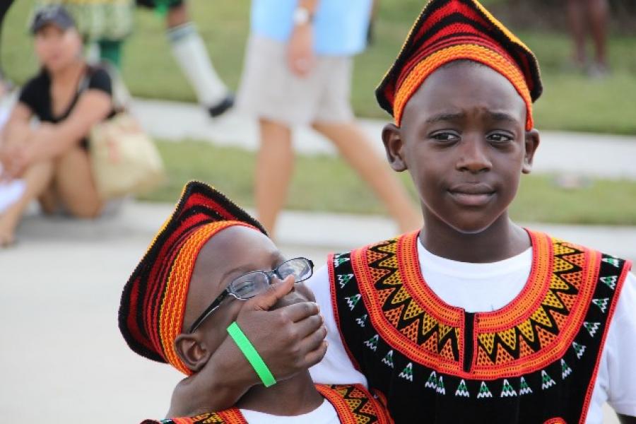 Two boys in traditional clothing.
