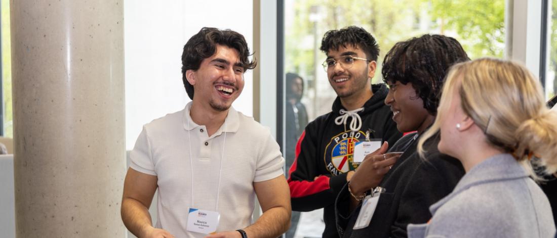 A group of research day partcipants laughing together