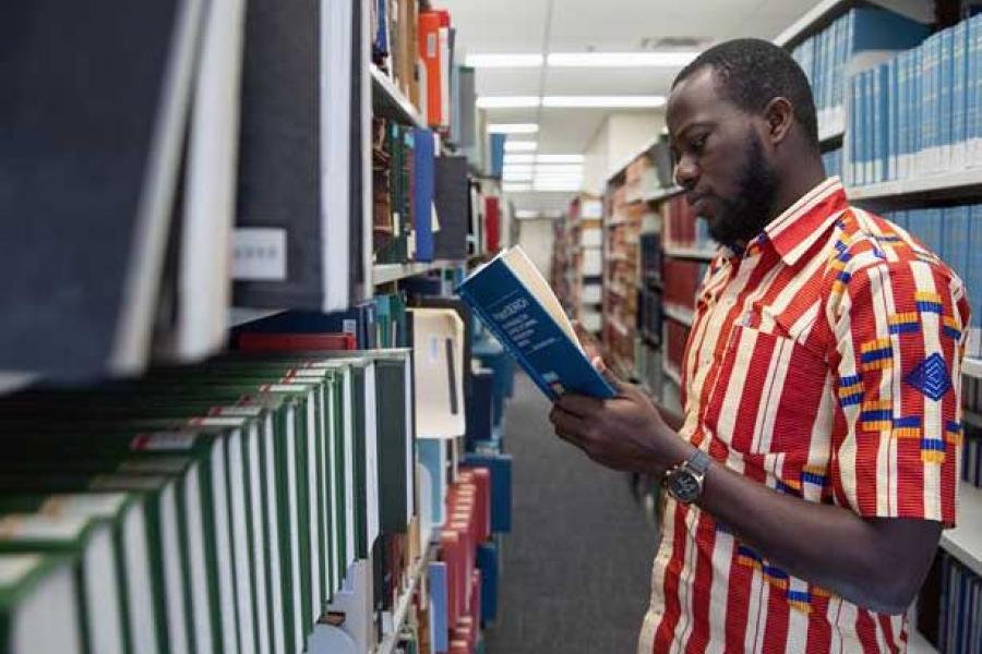 Law Grad Student researching the E.K. Williams Law Library