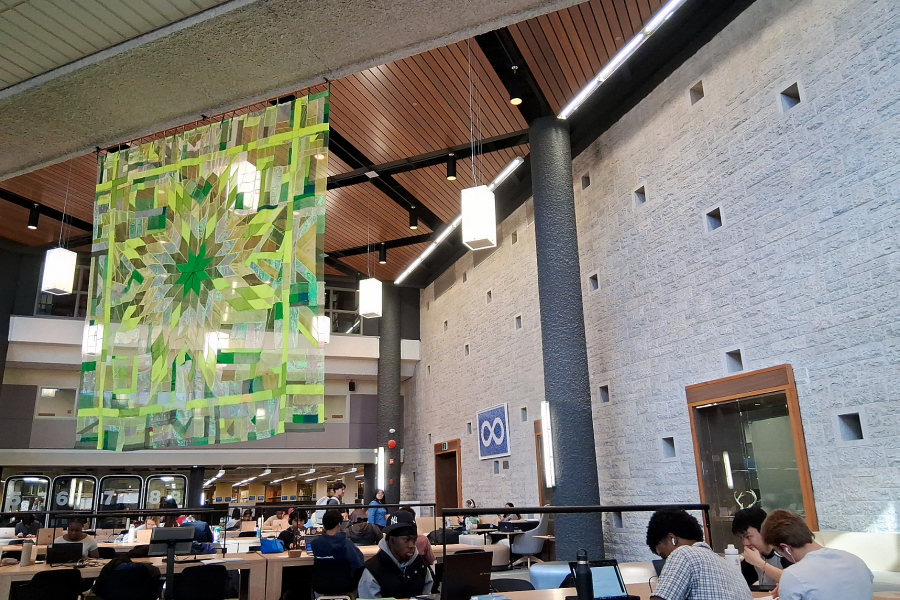 Transparent quilt hanging over study space in Dafoe