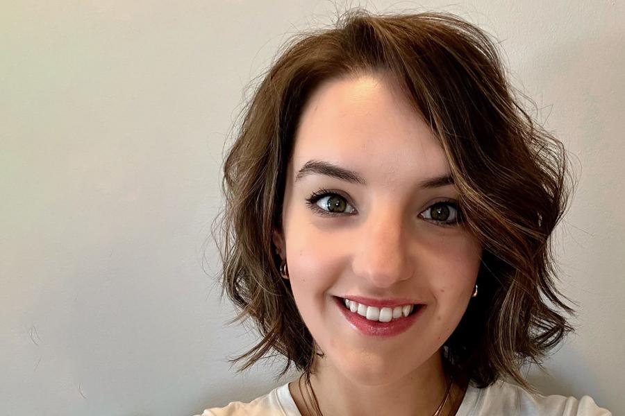 Emily Brownell smiling on a white background 