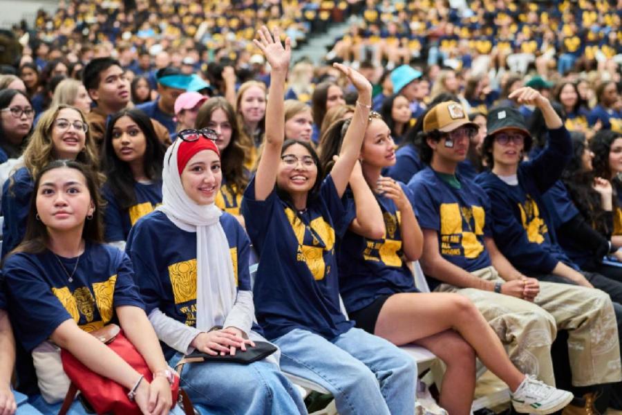 Welcome Day block photo from UM today magazine, student wearing Bison shirts