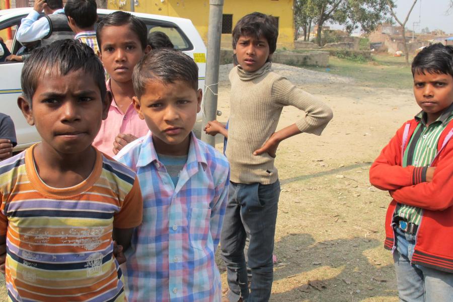 A group of young kids hanging out.