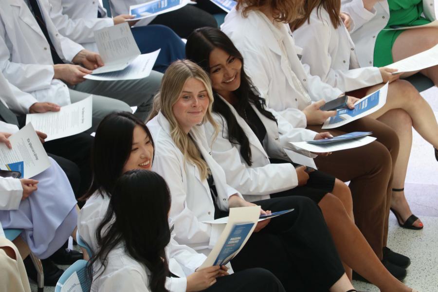 Students seated in the crowd at a convocation ceremony