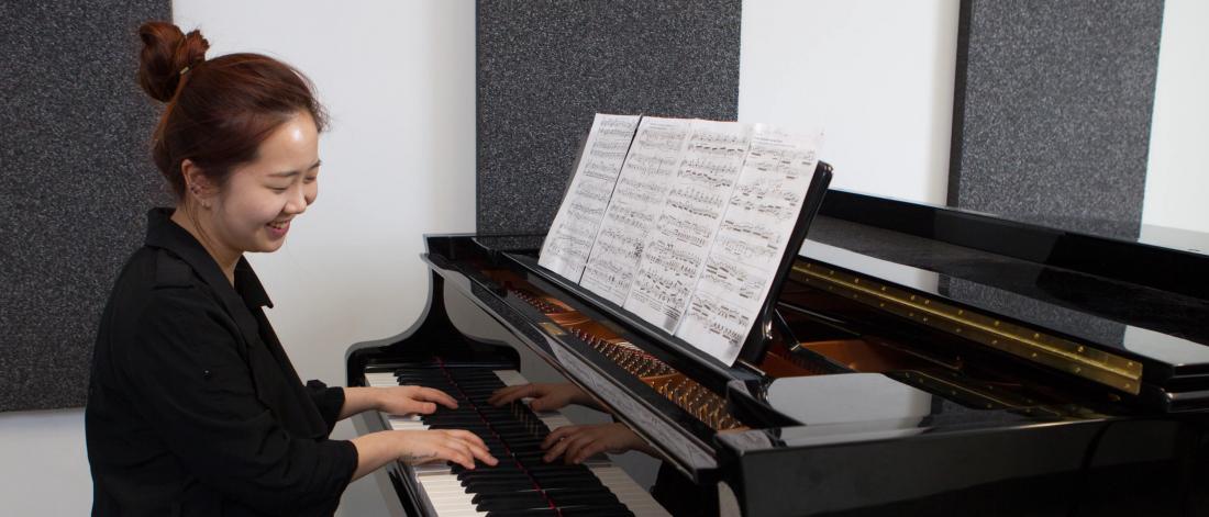 A prep studies student plays the piano. 